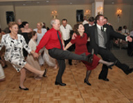 Guests Doing A Line Dance At A Party