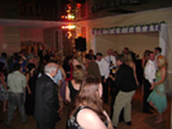 Guests Dancing With the Lights On In The Background